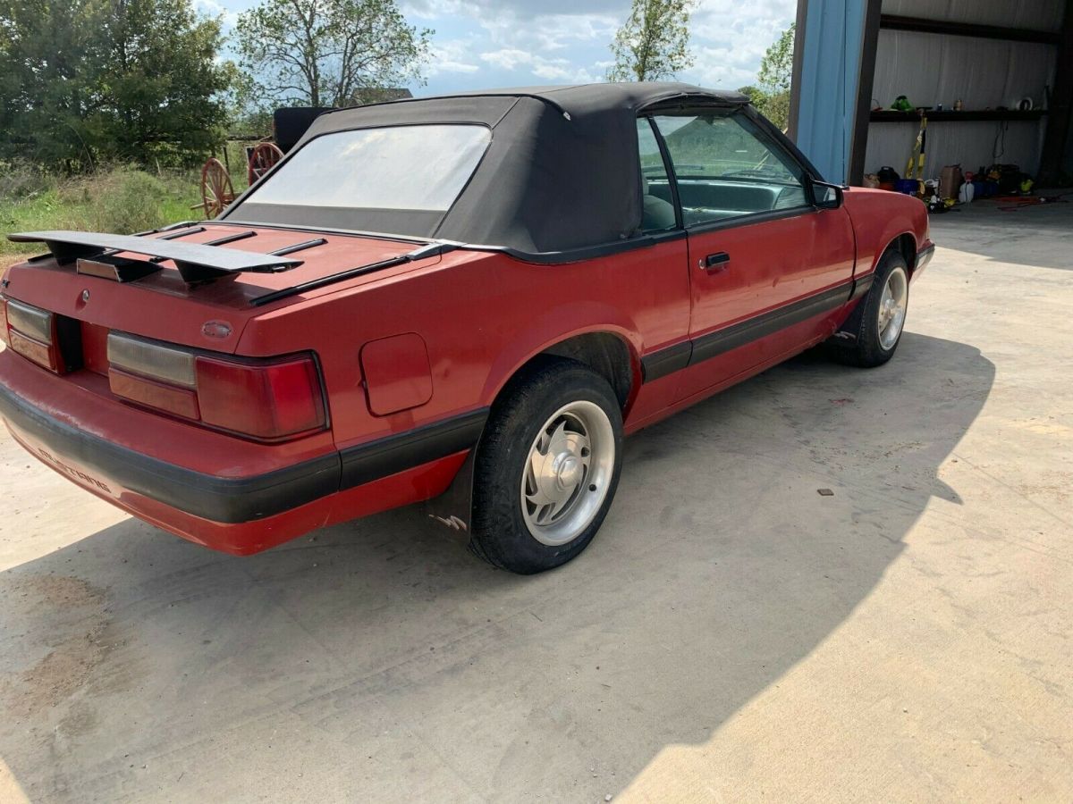 1988 red Ford Mustang Convertible