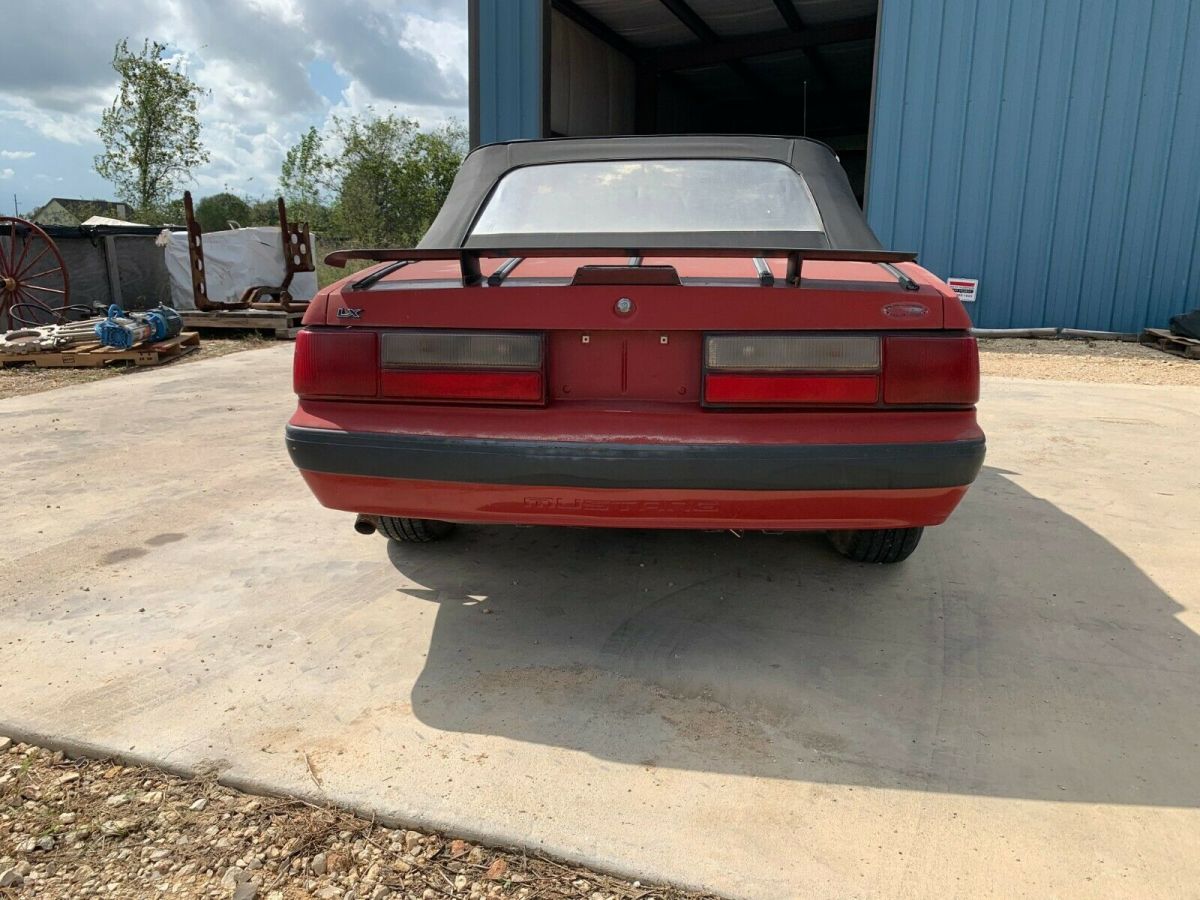 1988 red Ford Mustang Convertible