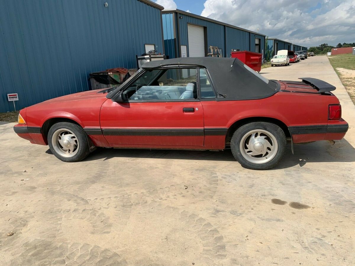1988 red Ford Mustang Convertible