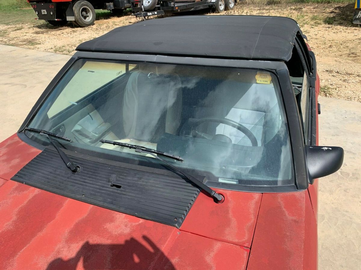 1988 red Ford Mustang Convertible