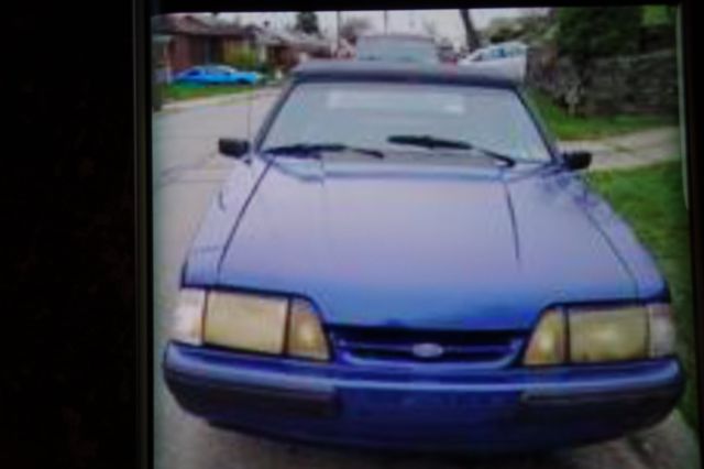 1988 blue mettal Ford Mustang Convertible