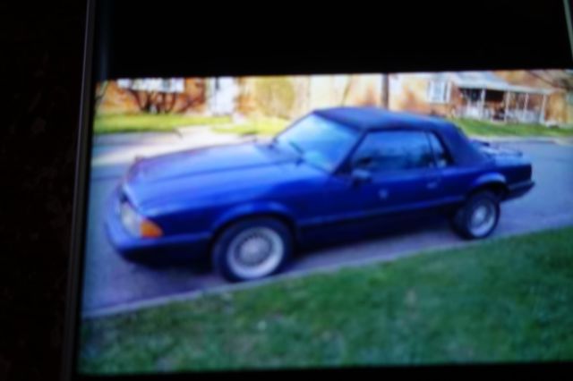 1988 blue mettal Ford Mustang Convertible