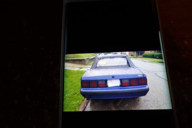 1988 blue mettal Ford Mustang Convertible