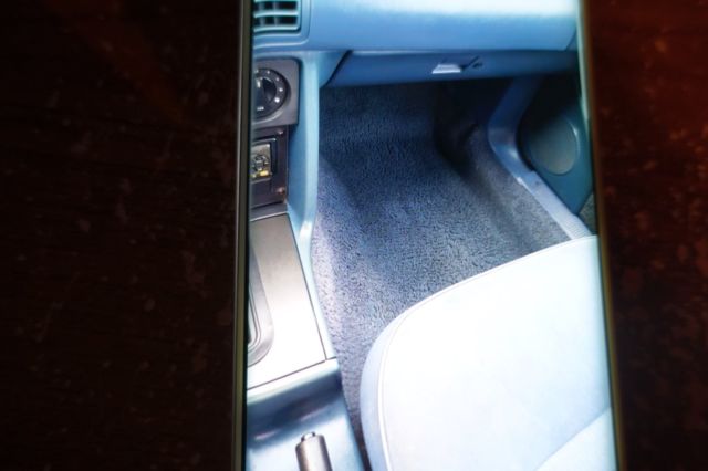 1988 blue mettal Ford Mustang Convertible