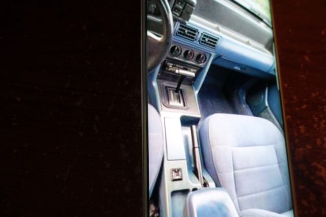 1988 blue mettal Ford Mustang Convertible