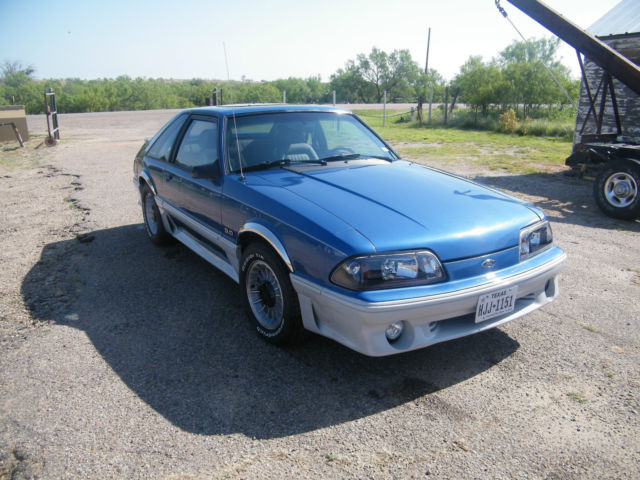 1988 black cherry Ford Mustang 2 dr