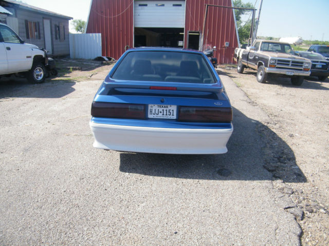 1988 black cherry Ford Mustang 2 dr