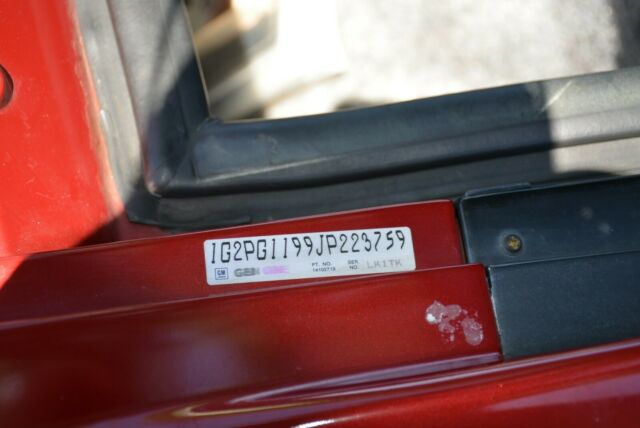 1988 Burgundy Pontiac Fiero Coupe