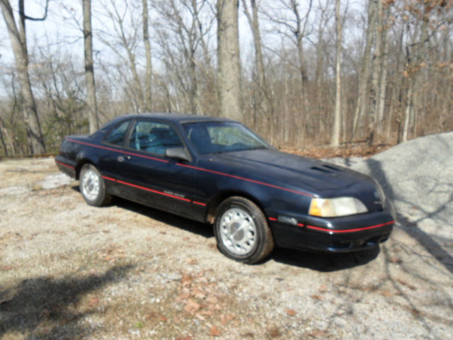 1988 dark blue Ford Thunderbird Coupe