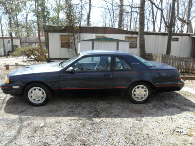 1988 dark blue Ford Thunderbird Coupe