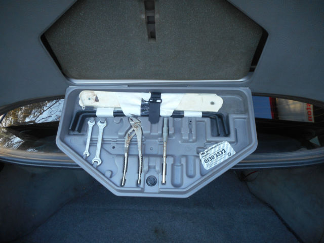 1989 bronze BMW 7-Series Sedan