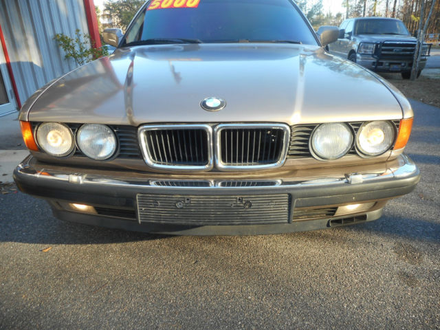 1989 bronze BMW 7-Series Sedan