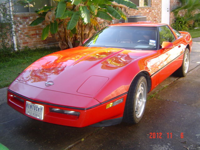 1989 red Chevrolet Corvette