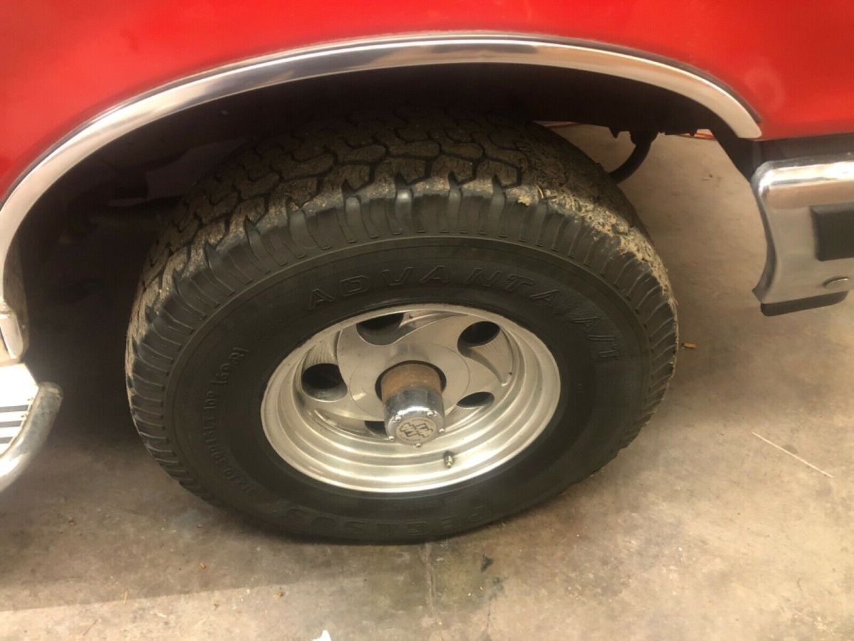 1989 Red and tan Ford Bronco SUV