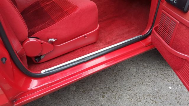 1989 red and white two tone Ford Bronco II SUV
