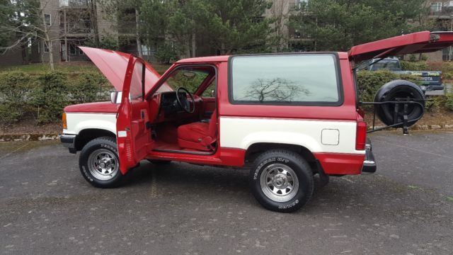 1989 red and white two tone Ford Bronco II SUV