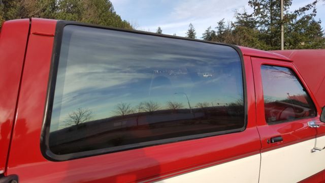 1989 red and white two tone Ford Bronco II SUV