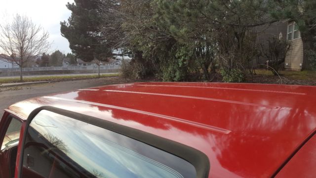 1989 red and white two tone Ford Bronco II SUV