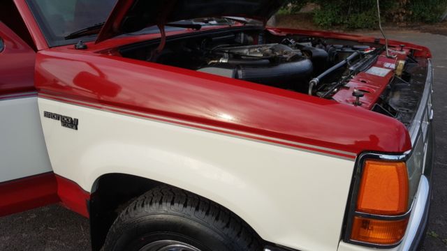 1989 red and white two tone Ford Bronco II SUV