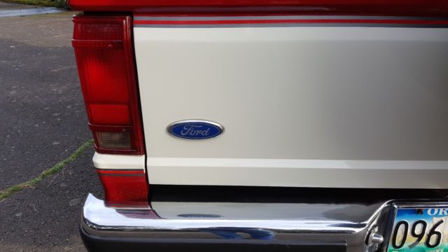 1989 red and white two tone Ford Bronco II SUV