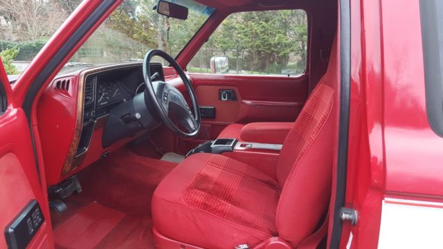 1989 red and white two tone Ford Bronco II SUV