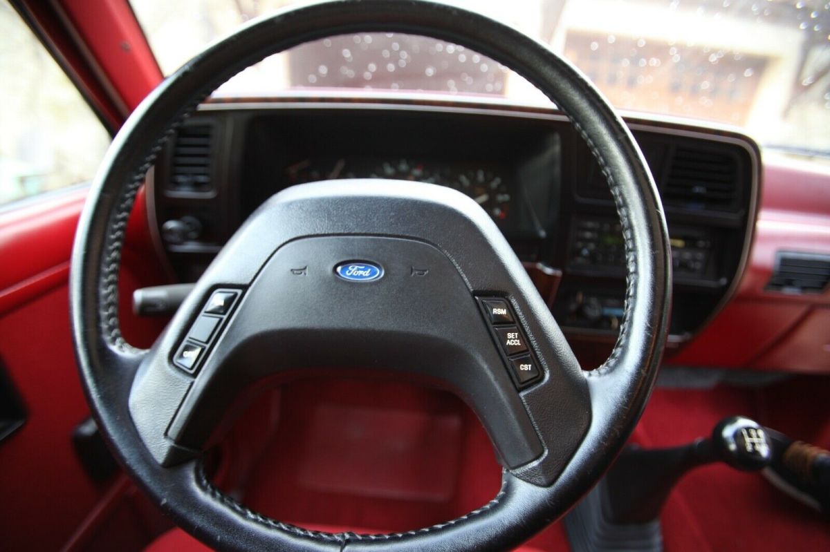 1989 red and Silver Ford Bronco II SUV