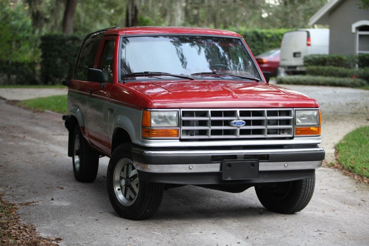 1989 red and Silver Ford Bronco II SUV