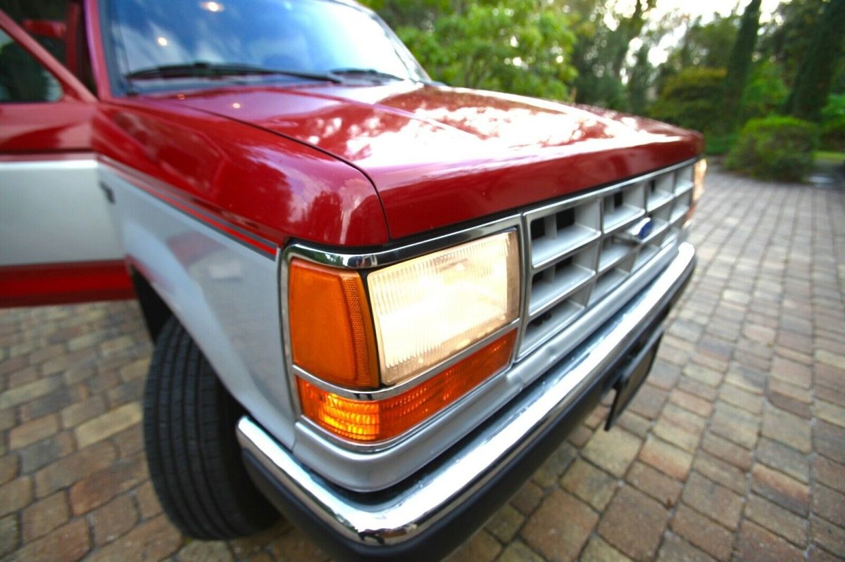 1989 red and Silver Ford Bronco II SUV