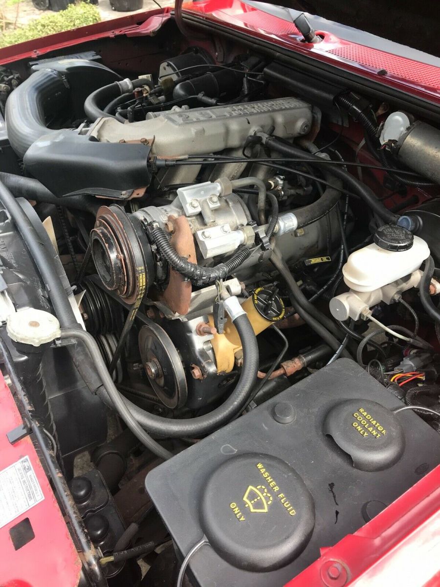 1989 red and Silver Ford Bronco II SUV