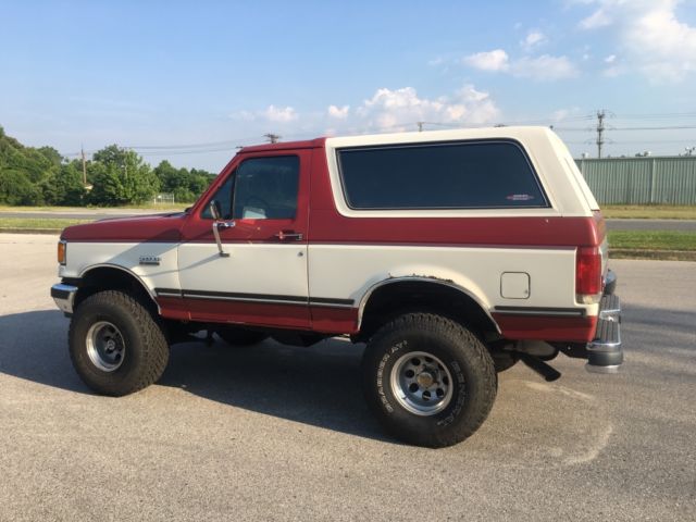 1989 Red and White Ford Bronco SUV