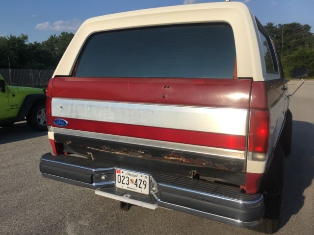 1989 Red and White Ford Bronco SUV