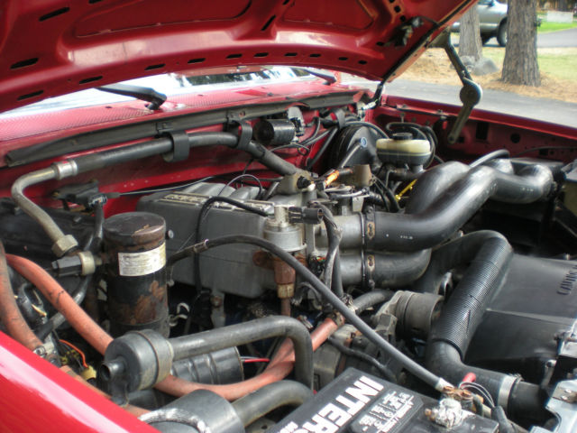 1989 Red and Tan Ford Bronco Two Door
