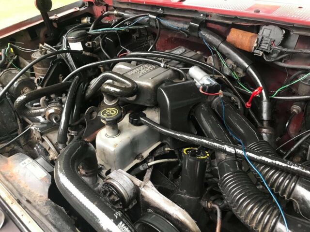 1989 Red Ford F-150 Standard Cab Pickup