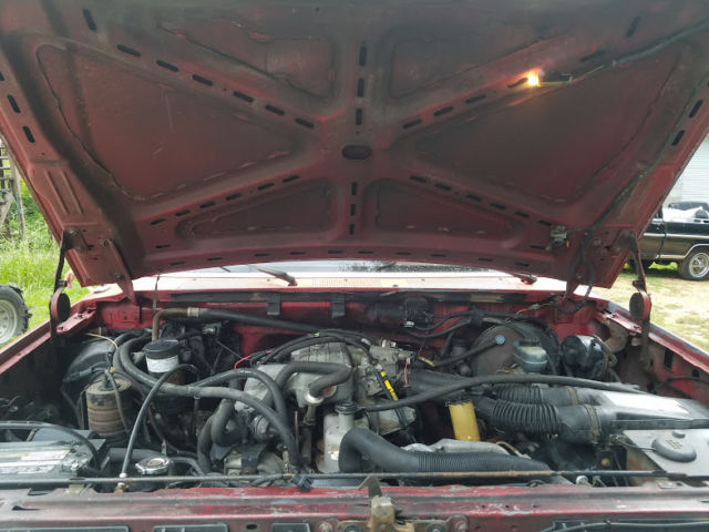 1989 Red Ford F-150 Standard Cab Pickup