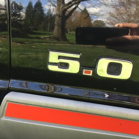 1989 black and gray Ford Mustang Hatchback