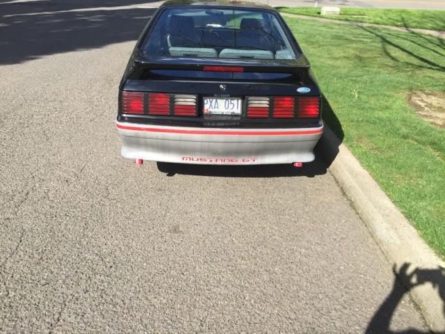 1989 black and gray Ford Mustang Hatchback