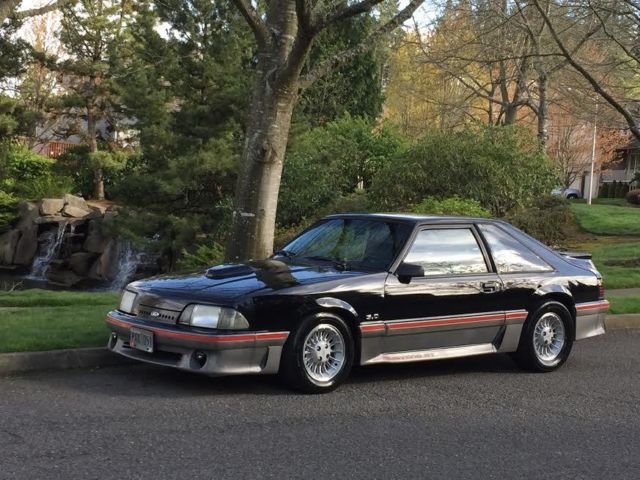 1989 black and gray Ford Mustang Hatchback