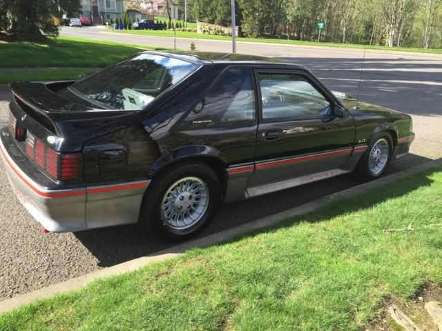 1989 black and gray Ford Mustang Hatchback