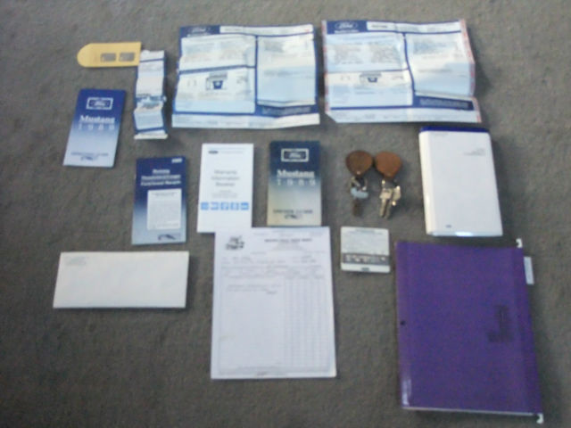 1989 red Ford Mustang Hatchback