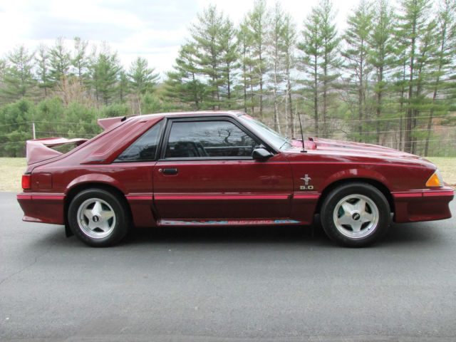1989 red Ford Mustang Hatchback