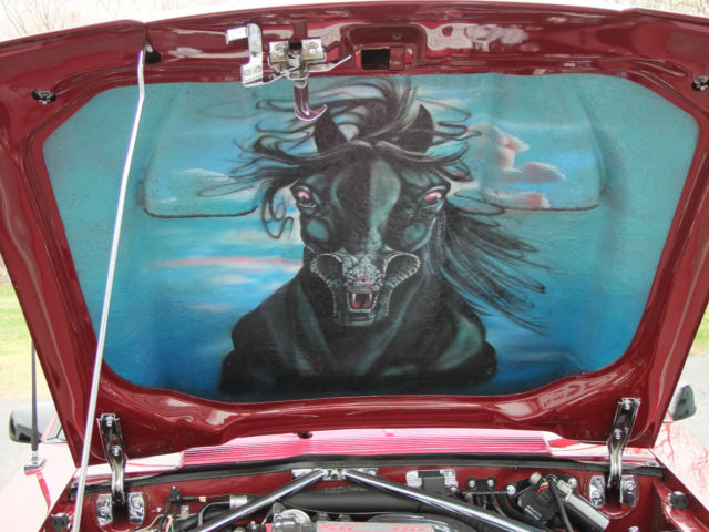 1989 red Ford Mustang Hatchback