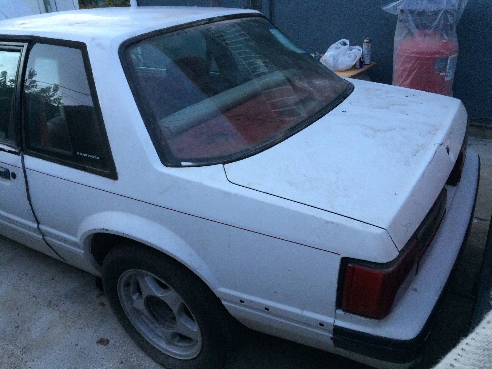 1989 Pearl White/Flat Black Ford Mustang Sedan