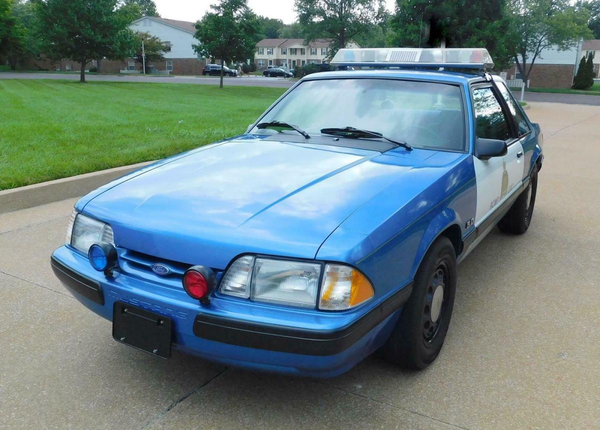 1989 Blue Ford Mustang --