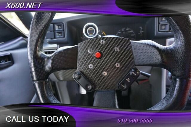 1989 White Ford Mustang --