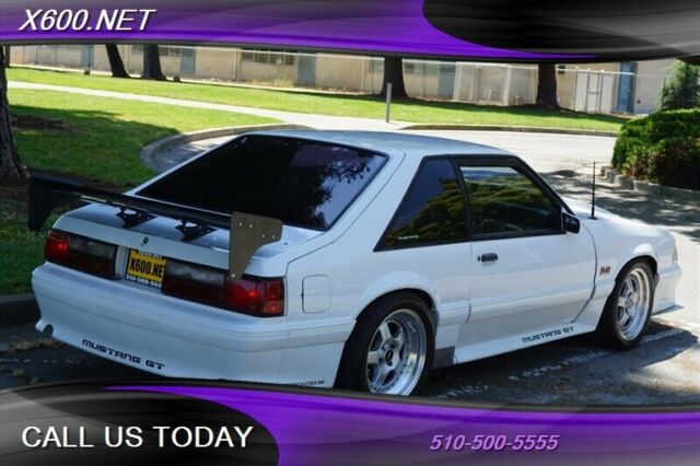 1989 White Ford Mustang --