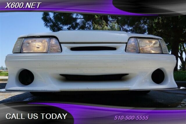 1989 White Ford Mustang --