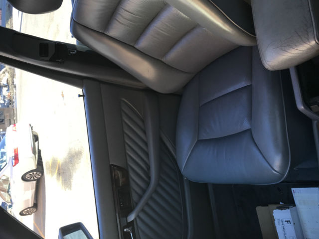 1989 white Mercedes-Benz 500-Series sedan