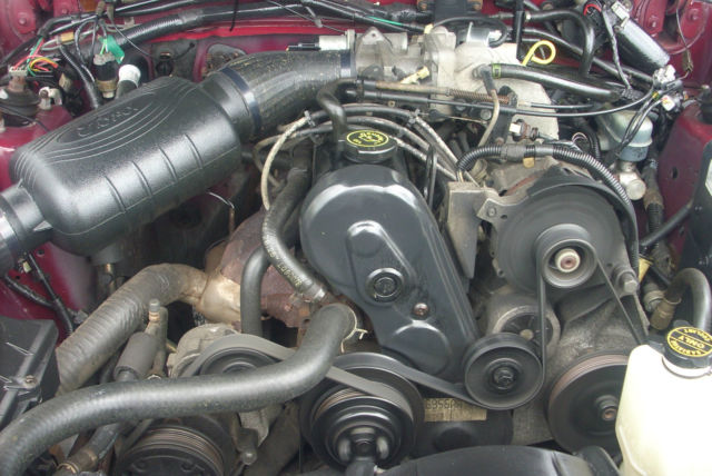 1989 Burgundy Ford Mustang Hatchback