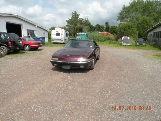 1989 red Buick Reatta Coupe