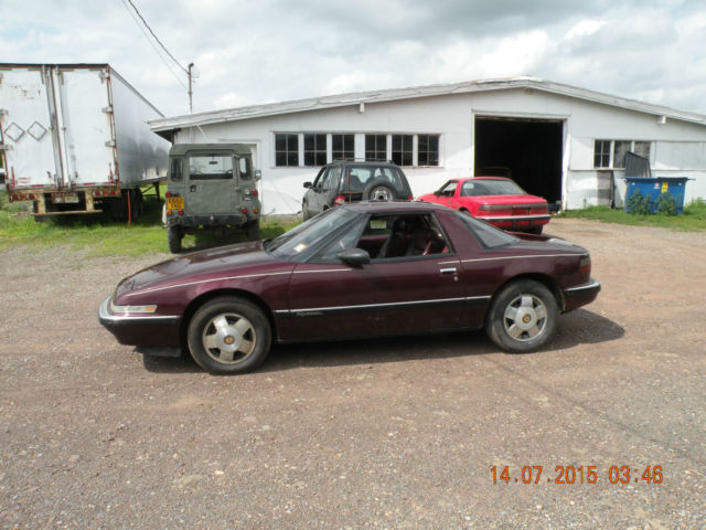 1989 red Buick Reatta Coupe